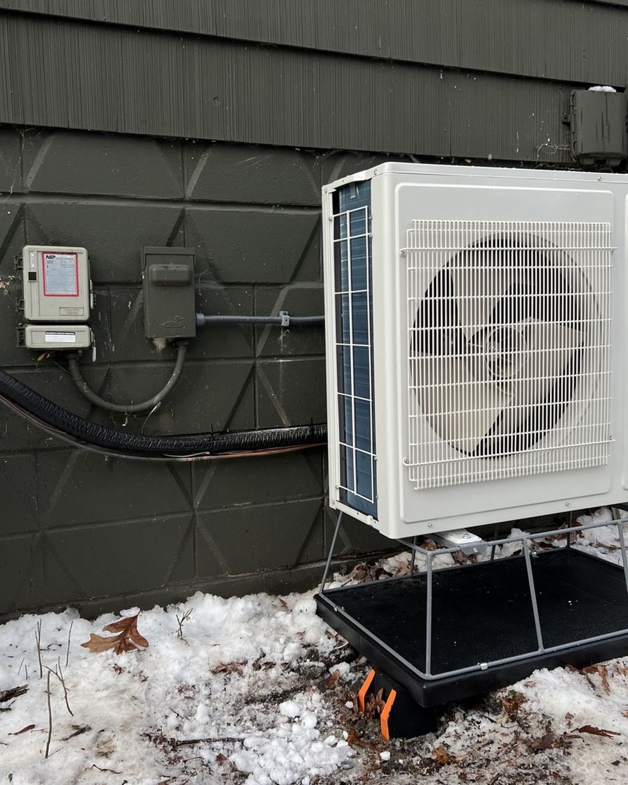 Heat pump on a snow stand